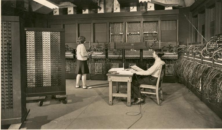 Jean & Arthur Burks | Jean programs ENIAC with the assistance of Senior Engineer Arthur Burks, 1946. (Image originally appeared in Science Illustrated in 1946.  The image was given to Jean Jennings Bartik in 1946, who in turn (along with her neice Diane Passmore) gifted it to The Jean Jennings Bartik Computing Museum in 2002. The Bartik Museum has the only known (at this time) existing original print of this image. All rights served).