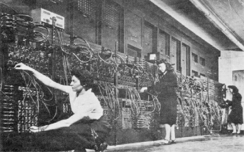 Jean, Marlyn and Ruth program ENIAC | Left (Back): Jean Jennings Bartik. Center: Marlyn Wescoff.  Right (Kneeling): Ruth Lichterman. Jean Jennings Bartik, Marlyn Wescoff, and Ruth Lichterman program the ENIAC. (U.S. Army photo from the archives of the ARL Technical Library) 